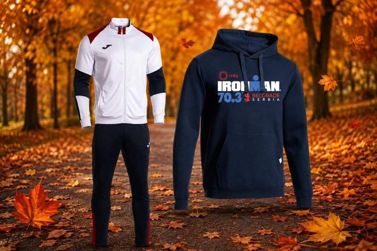 JOMA trenerka i IRONMAN 70.3 Belgrade duks na jesenjoj stazi okruženoj opalim lišćem, sportska garderoba za trčanje i trening tokom hladnijih dana.
